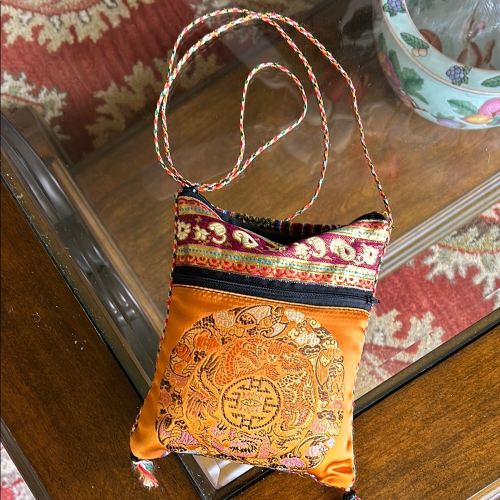 Vibrant Orange Crossbody Bag with Intricate Gold Embroidery